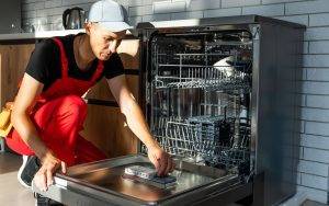 Repairing Dishwasher Appliance In Kitchen