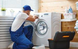 Plumber Repairs Washing Machine