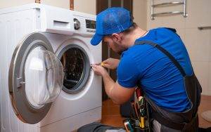 Repairs A Washing Machine In Home